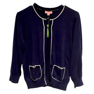 Lilly Pulitzer cardigan with white piping.